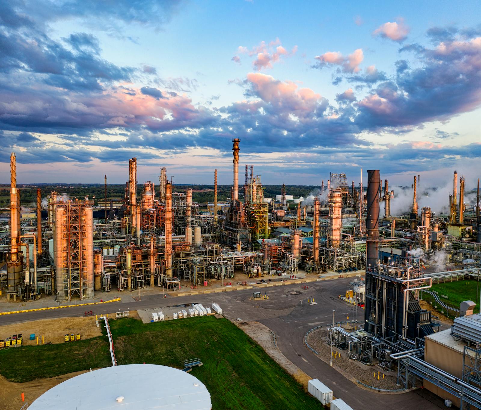 Aerial view of oil refinery at twilight — industrial energy production